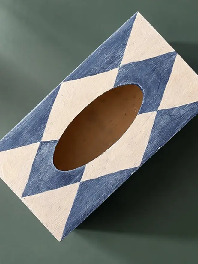 hand-painted harlequin tissue box. a tissue box in blue and white painted harlequin pattern.