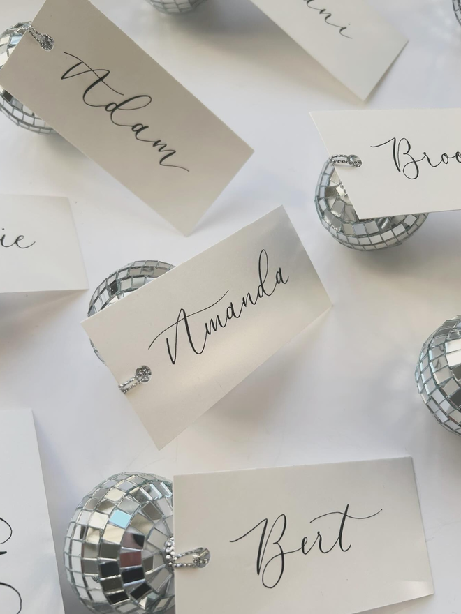 handwritten calligraphy disco ball wedding place card settings