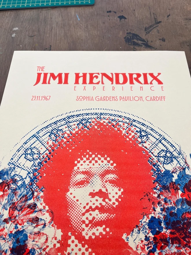 'Jimi Hendrix' Handmade Risograph Gig Poster, laying on a wooden table. 