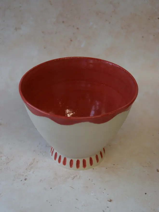 Handmade ceramic bowl — red scalloped rim and glossy red interior