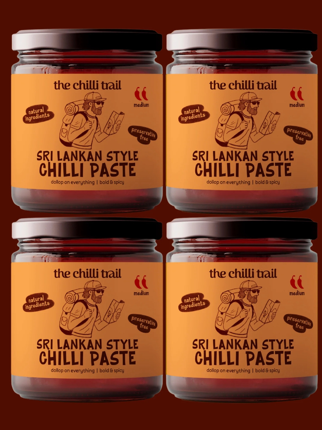 'the original 4' chilli paste bundle. four jars of chilli paste photographed against a dark red background.