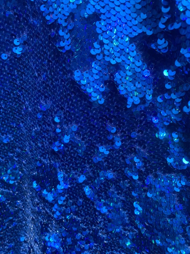 Close up material of the Fumbalina_Royal Blue Holographic Sequin V-neck Kaftan Gown.