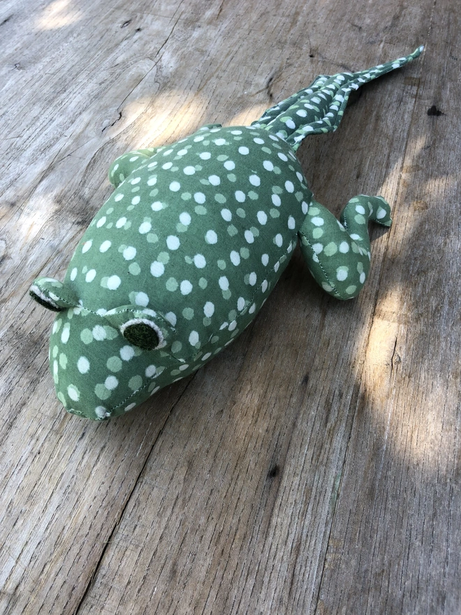 Spotty green and white tadpole