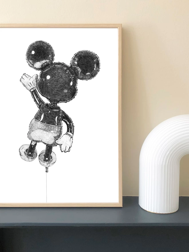 Art print of a hand drawn illustration of a mickey balloon displayed in a frame