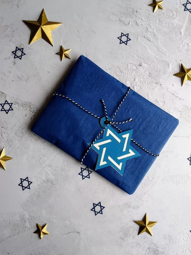 Star of David Hanukkah Gift Tag on present wrapped in dark blue tissue paper