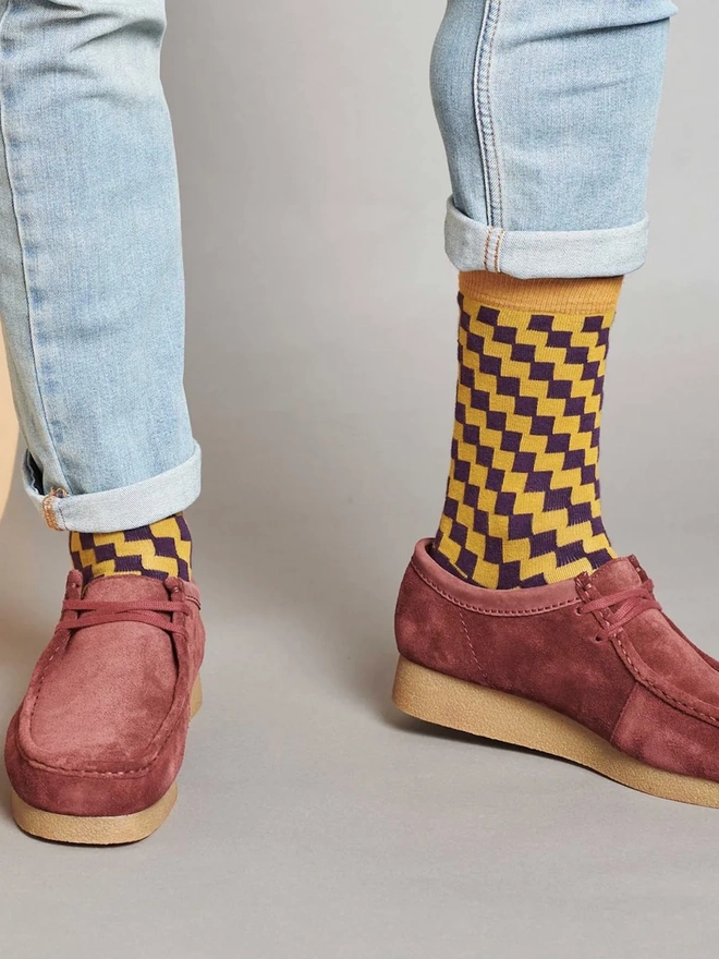 Men's Organic Cotton Ankle Socks Packs (Sets Of 3), a man wearing a pair of colourful patterned socks. 