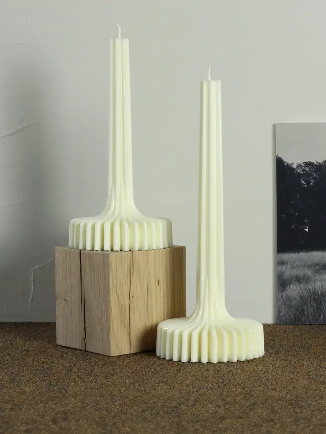 geometric aromatherapy soy candles (pack of 2). candles displayed on wooden shelf.