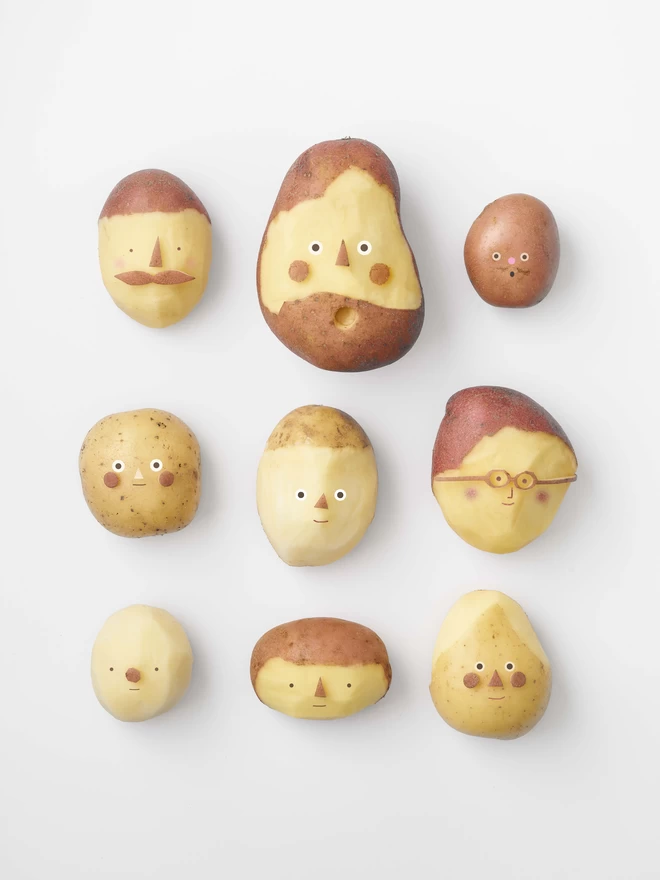 A3 art print of 9 potatoes with faces on a white background  