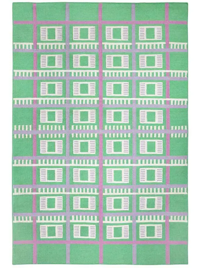 Labourdonnais Flatweave Rug, a colourful rug sitting on a plain surface. 