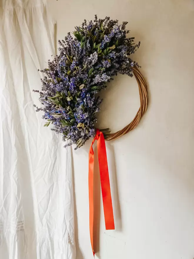 Lavender, Sage, Delphiumn & Eucalyptus Wreath seen with Orange Ribbon