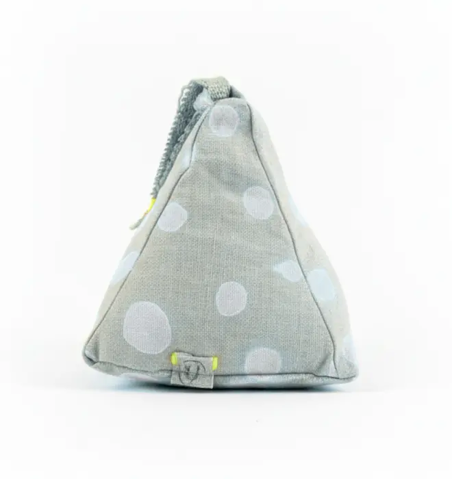 Hand Painted Linen Sustainable Doorstop In Polka Dot Print, a metallic silver doorstop against a white background. 