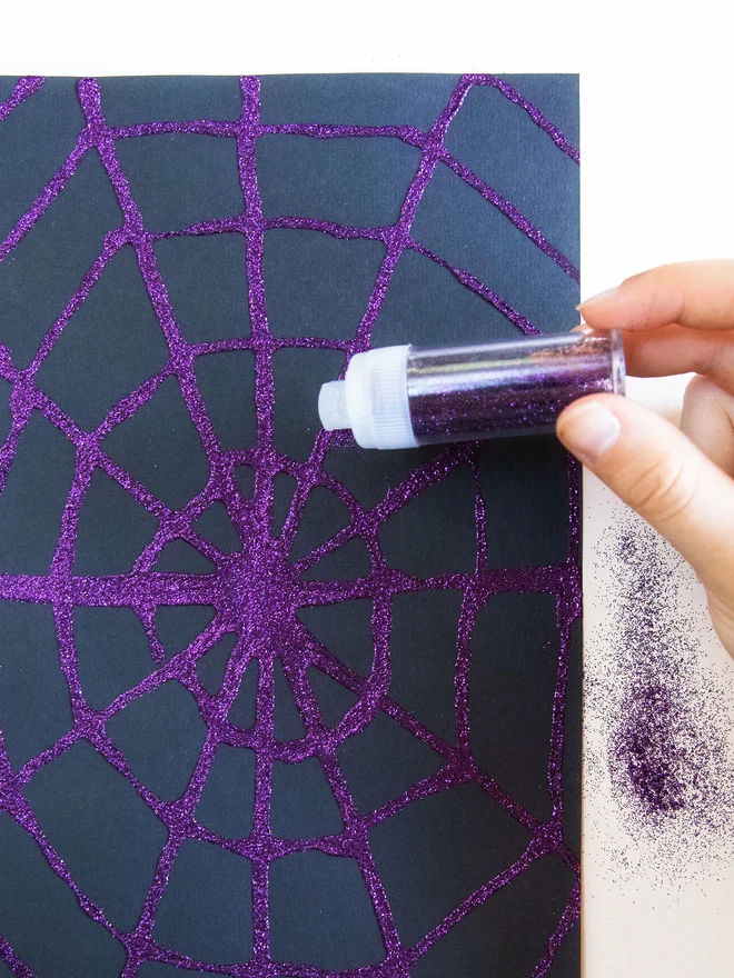 Halloween creative activity for children - create your own glitter web