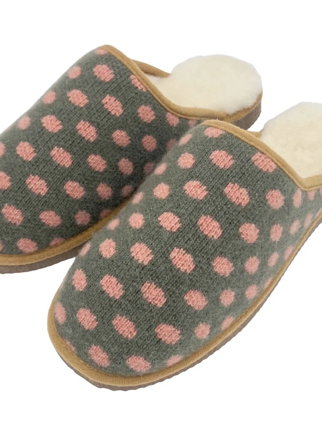 Lambswool & Sheepskin Slippers, a pair of colourful lambswool and sheepskin slippers sitting on a plain white surface. 