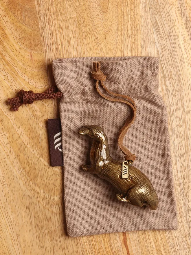 Metal Otter hanging decoration with linen gift bag