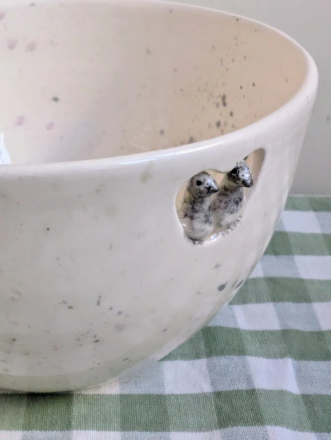 pigeon couple bowl with grey splatters and two tiny pigeon birds perched in a cut out heart