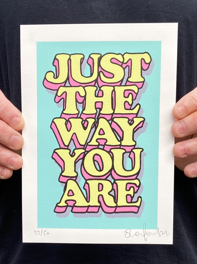 "Just The Way You Are” Mini A5 Hand Pulled Screen Print In pastel blue with the words just the way you are in hand drawn lettering printed on top with black outline and pink and yellow fill