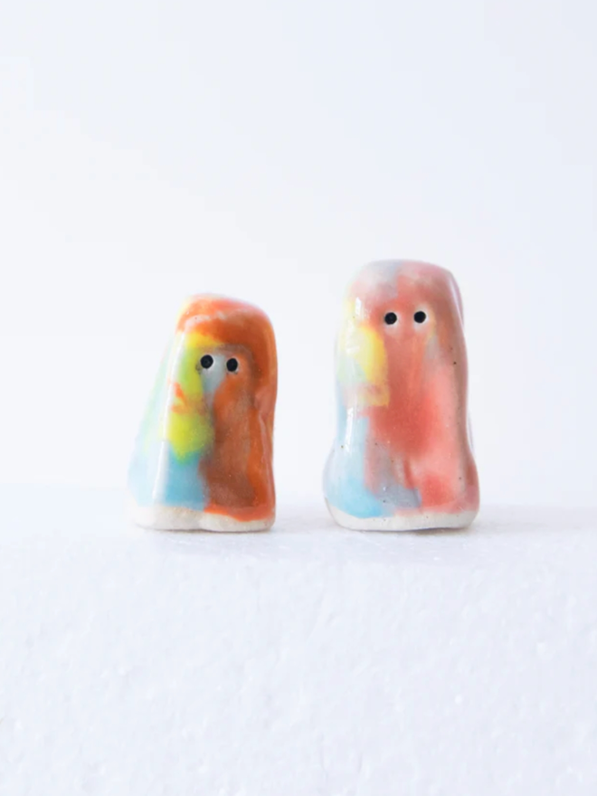 Wee Guys. Two multicoloured wee guys.