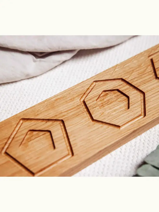 Wooden Shape Tracing Puzzle Heirloom Toy, on a table. 