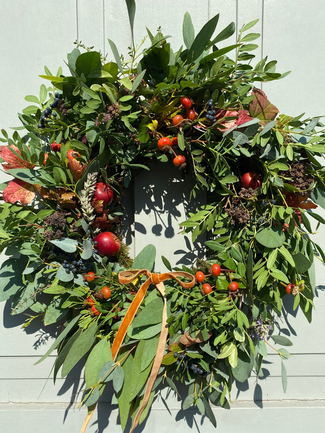 Autumn Hedgerow Wreath with Berries, Herbs, Foliage and Rosehips. Light door.