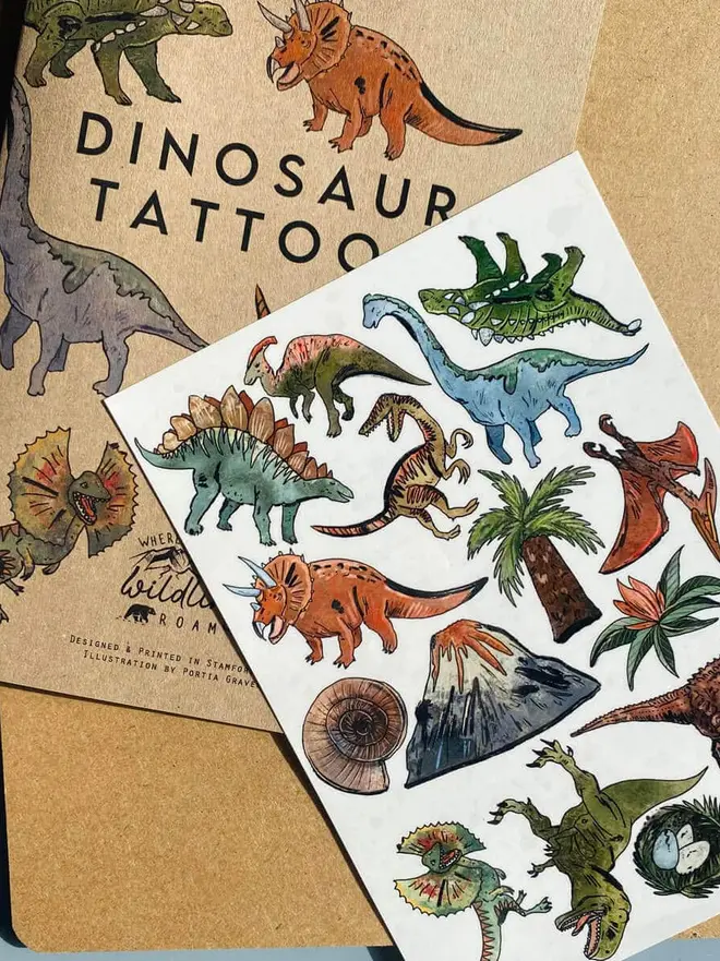 Dinosaur & Fantasy Temporary Tattoos, a brown kraft paper booklet titled "MYTHICAL CREATURES TATTOOS" sits next to a sheet of colourful mythical creature temporary tattoos.
