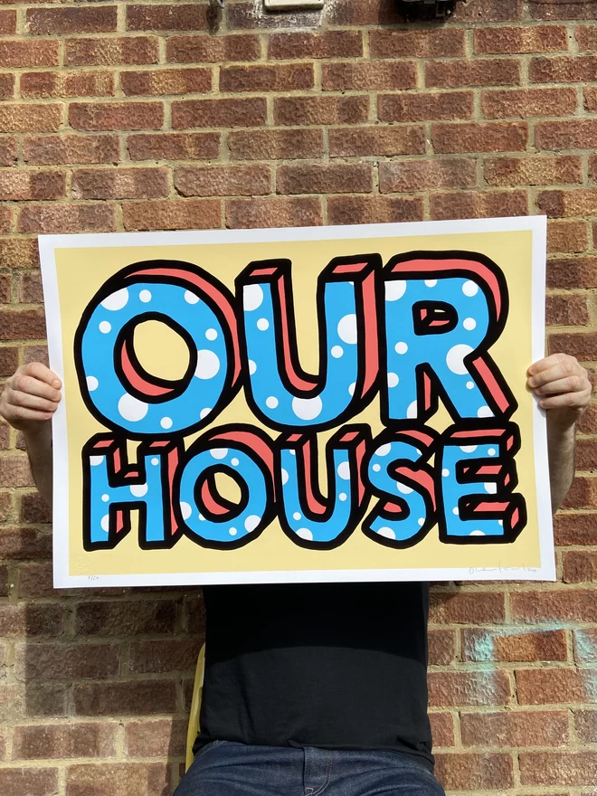 Large "Our House" Handpulled Screenprint with cream background and large hand drawn screen printed type that says “Our House” type has blue lettering with white bubbles 