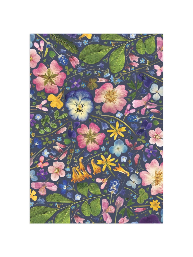 Colourful wrapping paper sheet with a pressed flower design.