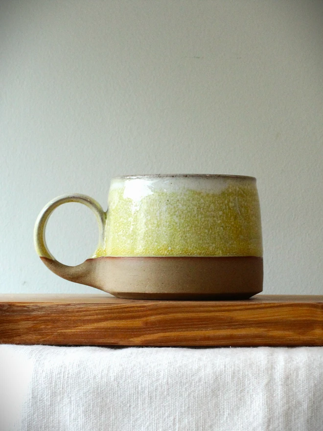 yellow handmade ceramic cup