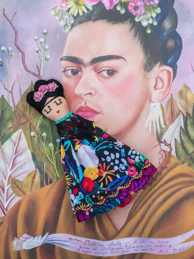 Jennifer Jackson Frida Khalo doll seen on a book cover.