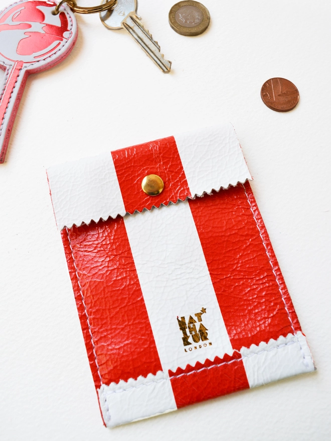 red and white striped leather coin purse