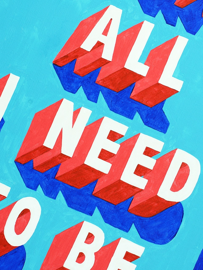 Close-up section of a typographic art print showing the bold 3D words “ALL” and “NEED” in red and white lettering with blue shadows. Parts of the surrounding words are visible at the edges. The background is bright blue.