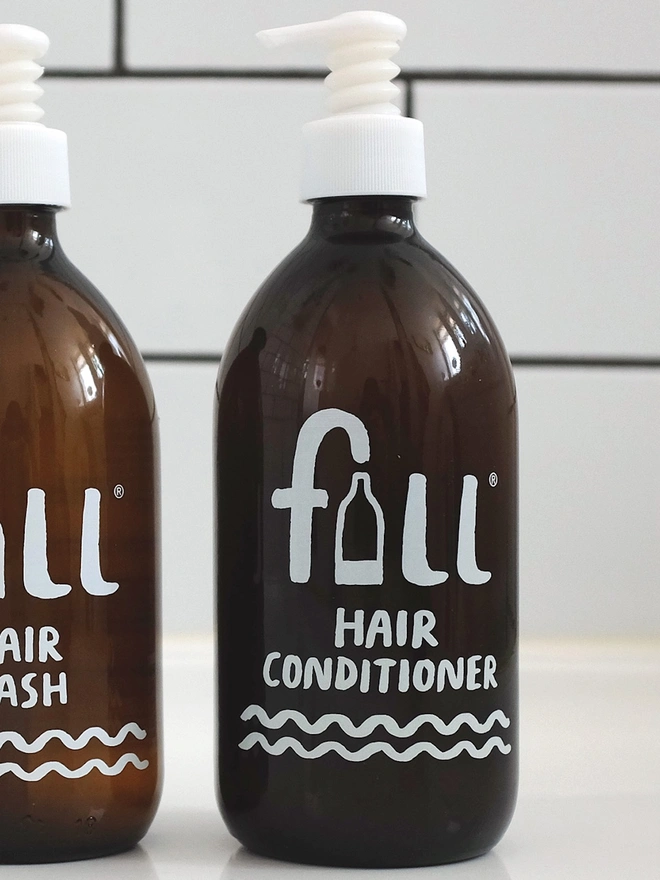 dark amber glass bottle of hair conditioner