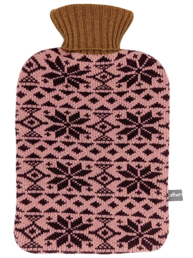 Lambswool Hot Water Bottle Cover, a colourful hot water bottle cover sitting on a plain white surface. 