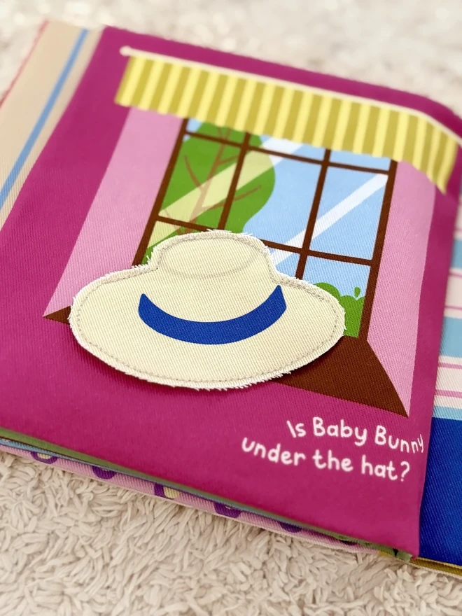 Page of Where's Baby Bunny? Lift-the-flap Cotton Soft Book, showing a window and a hat to lift