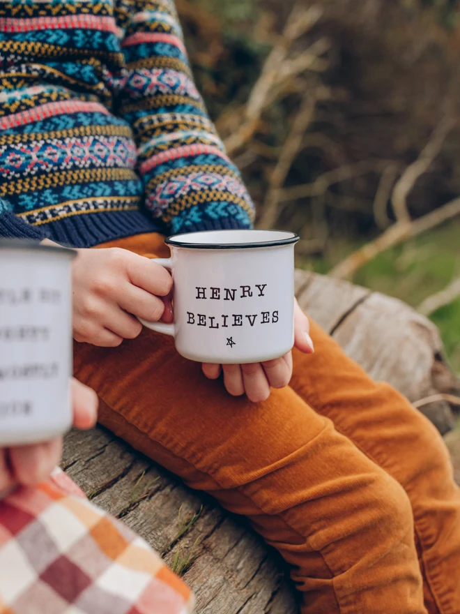 child holding personalised christmas mug