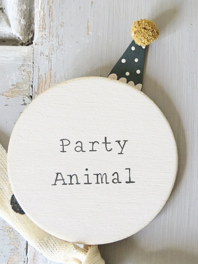 hand painted wooden cake topper with party animal message and hand made party hat