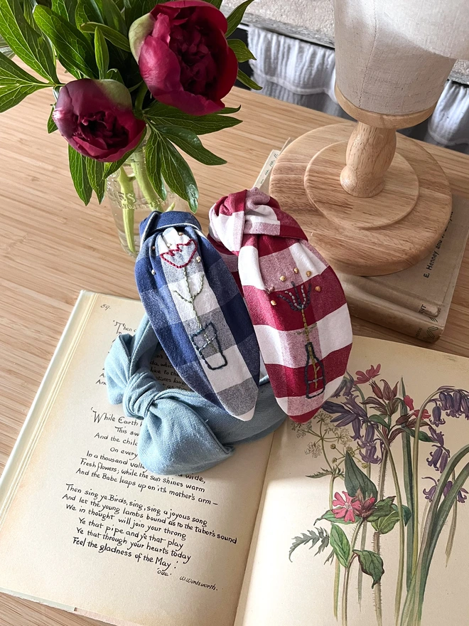 Embroidered Headbands on a vintage book