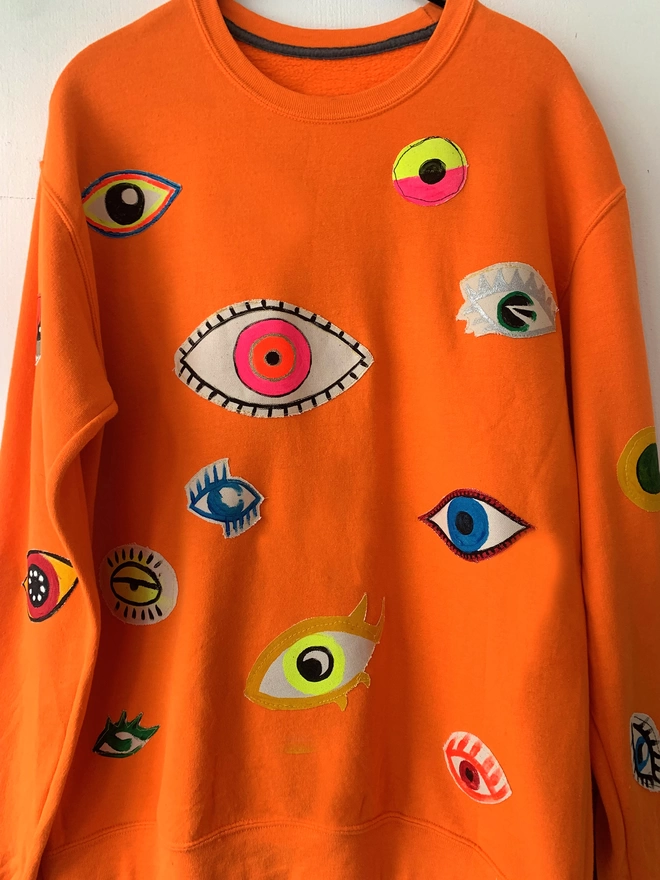 Sweater with lots of eye patches