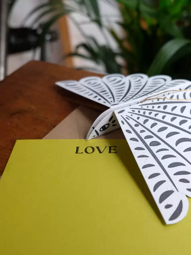 Green Love notecard and paper bird decoration to hang with gold thread.  