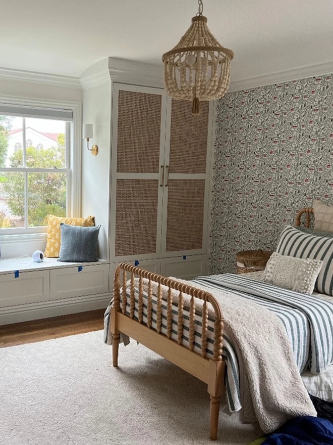English Country Cottages wallpaper feature wall in girls bedroom 