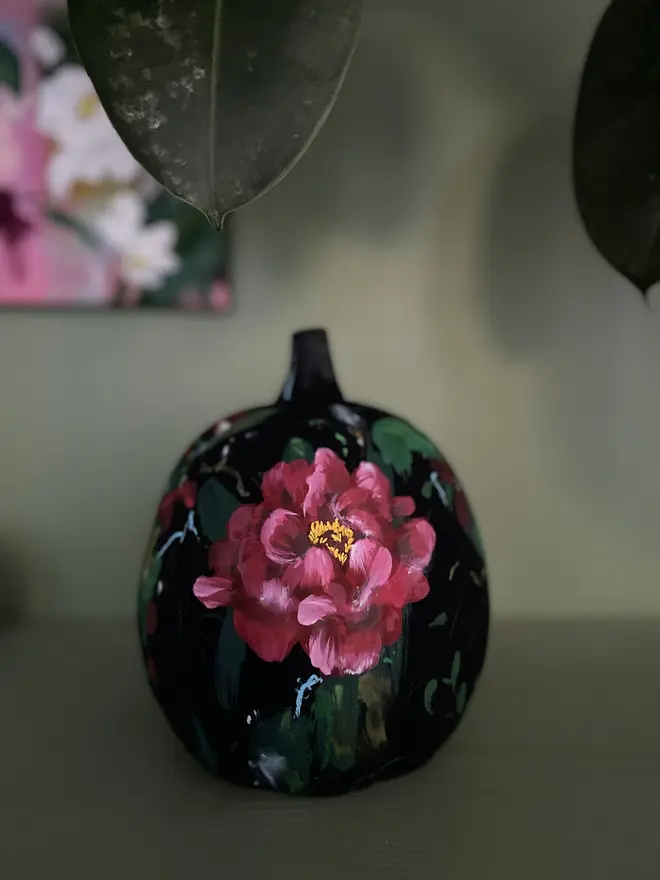 hand painted ceramic floral halloween pumpkin decoration black background with deep red peonies, Erysimum cheiri ‘Blood Red’ flowers