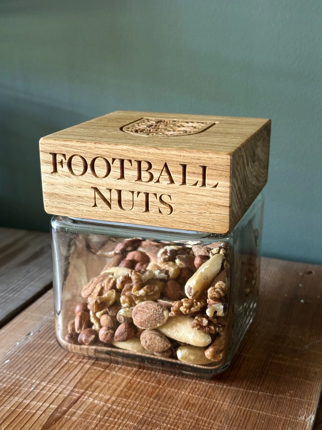 jar with sweets engraved with football nuts and the three lions crest