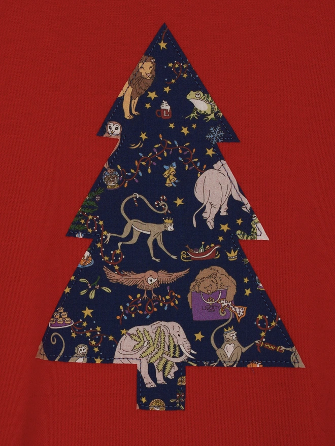 a red t-shirt with a christmas tree cut from Liberty Christmas print sewn onto the front