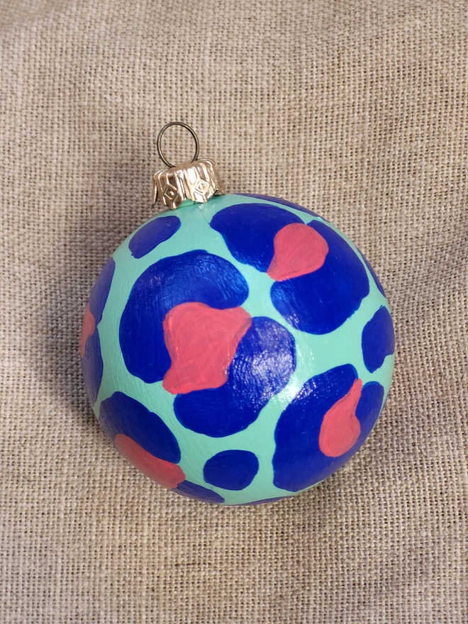 Mint green bauble with cobalt blue leopard print