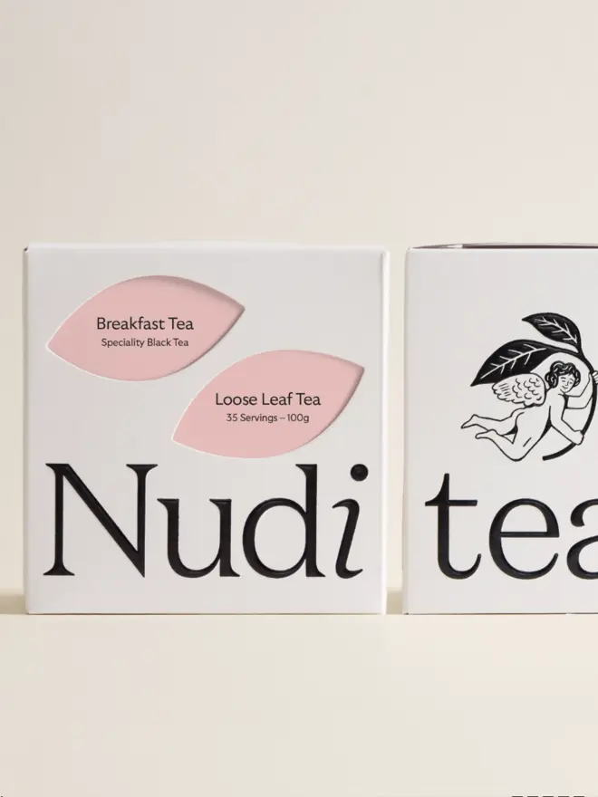 white box of tea with pink and black design