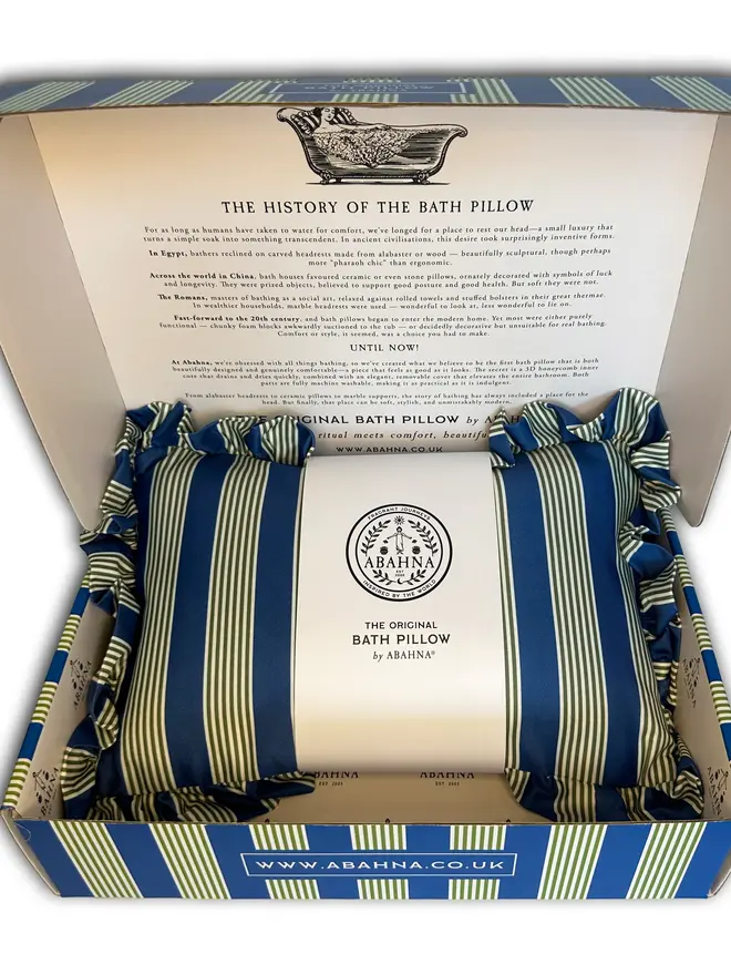 luxury frilled bath pillow. a blue and green striped bath pillow in a decorative box.