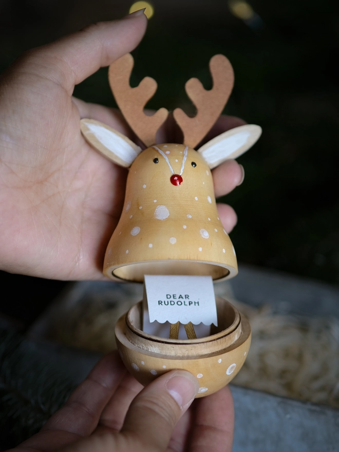 Handcrafted wooden Rudolph Christmas decoration opened to reveal a tiny “Dear Rudolph” note, 