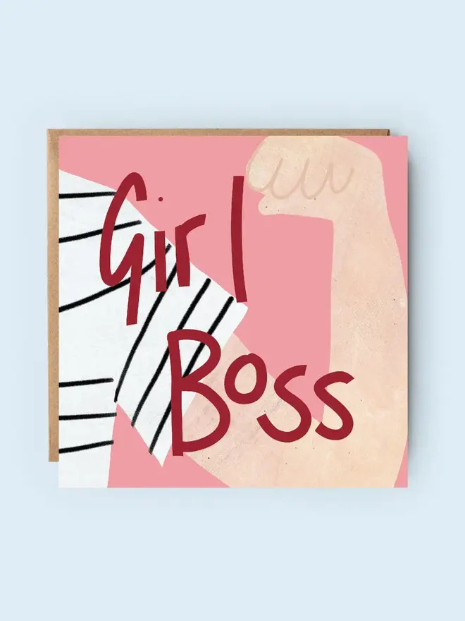 'girl boss' illustrated card. card photographed against plain blue backdrop.
