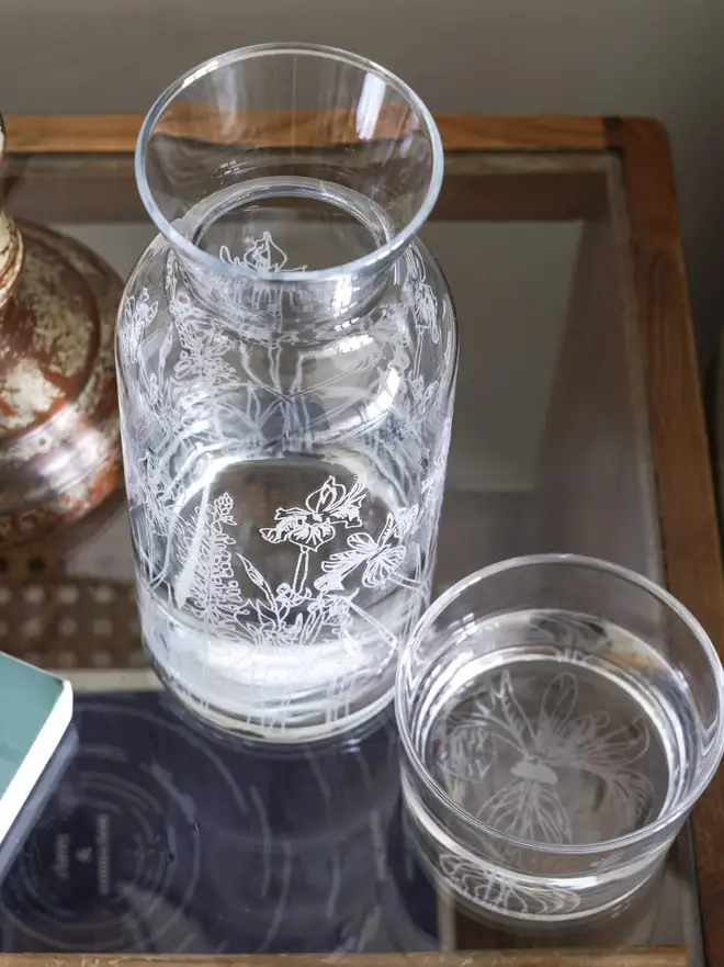Floral Mini Carafe & Glass Set, on a clear table. 