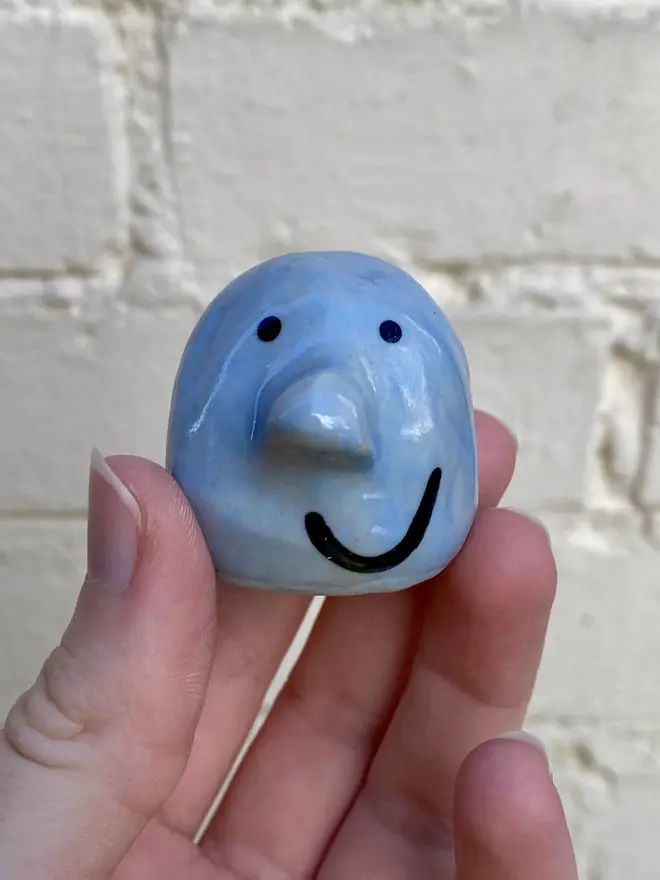 light blue handmade ceramic buddy ornament