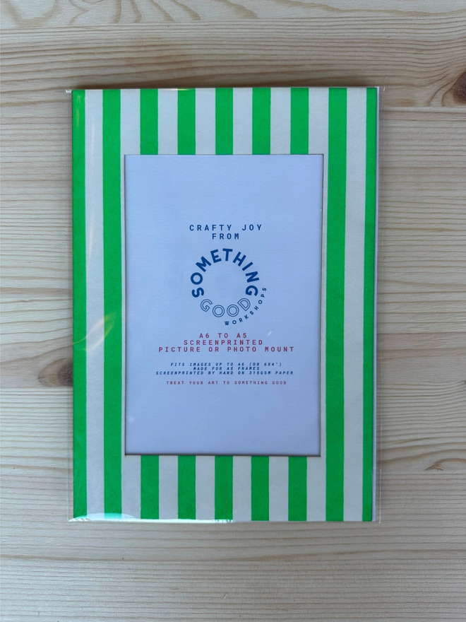 Thin Striped Screen Printed A6 / A5 / A4 Photo Mount. green striped mount pictured on a wooden table.